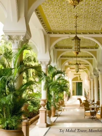 The beautiful, shaded corridors of the Taj Mahal Tower in Mumbai. The architecture provides a sense of history and timeless elegance.