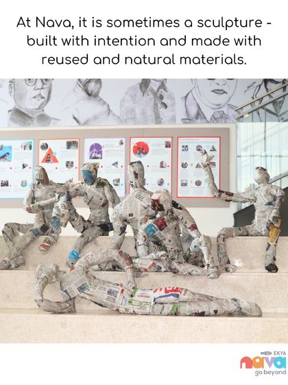 A stunning sculpture made from reused newspaper and other natural materials, created by students. This piece, displayed on campus, is a powerful statement about building with intention and sustainability.