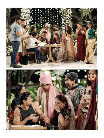 The moment of signing the marriage register, surrounded by laughing, emotional family members. This captures the official and emotional peak of their unique ceremony.
