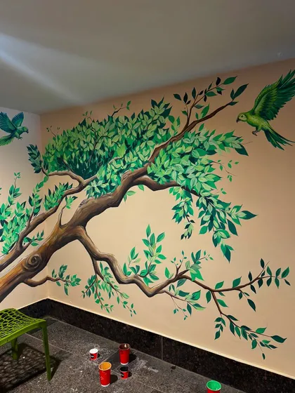 Nature is a constant inspiration. Here, I painted a sprawling tree branch with vibrant green parrots taking flight, turning a plain corner into a lively scene that brings the beauty of the outdoors inside.