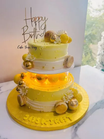 A stunning two-tier cake with lights in the separator, creating a beautiful glowing effect.