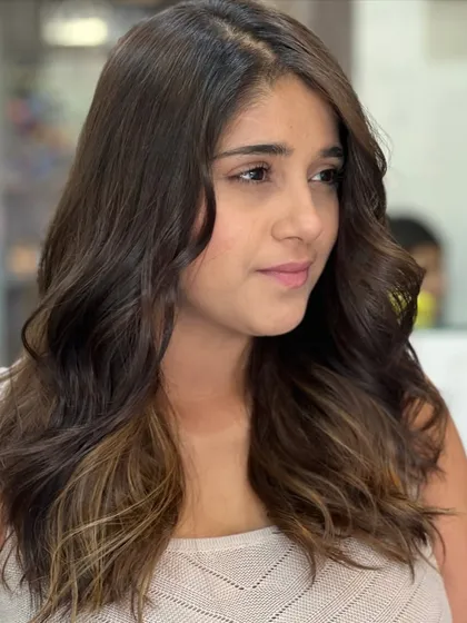 Another angle of this subtle caramel balayage. It's a perfect example of a modern, low-maintenance colour that looks effortlessly cool.