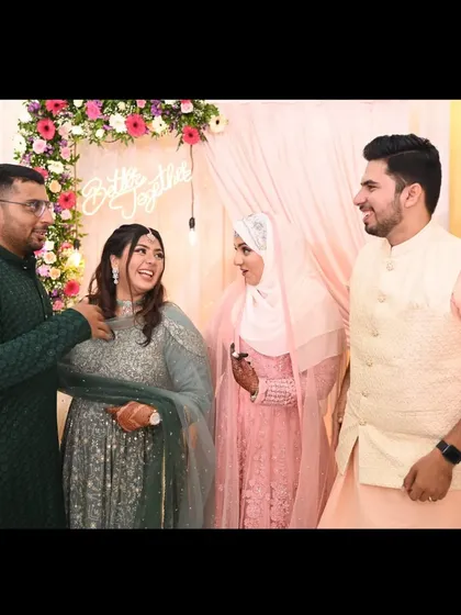 Candid laughter and conversation between two couples at an engagement party. These are the unposed, joyful moments that truly capture the spirit of the celebration.