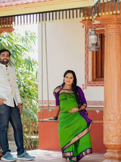 A relaxed portrait of the couple on the porch of a traditional house. The mix of modern and traditional attire shows how you can personalize your shoot.