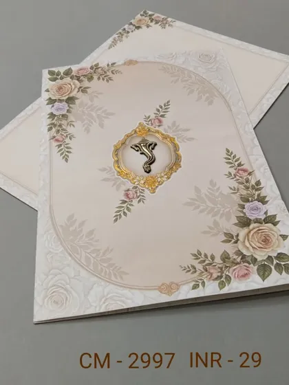 A beautiful invitation with a border of pastel roses and a central Ganesha emblem. The design is a perfect blend of romance and tradition.