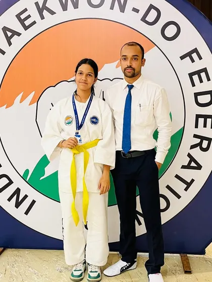 With another one of my dedicated students and her medal. Each athlete's journey is unique, and I'm here to guide them through it.