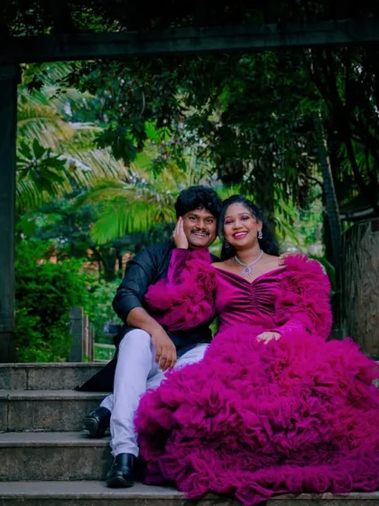 A dramatic and romantic portrait of an expecting couple. I use architectural elements and natural surroundings in Bangalore's parks to frame your story, creating timeless images that feel both grand and intimate.