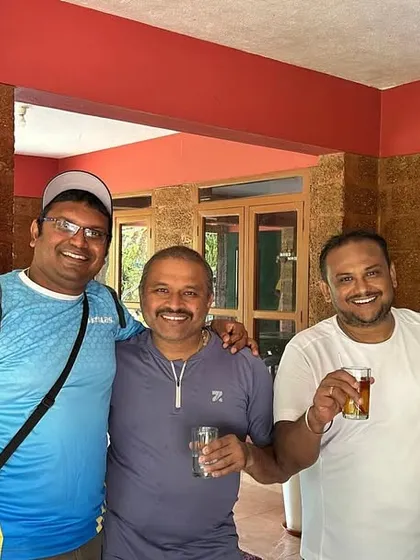 The trek leader with fellow adventurers, enjoying a cup of tea and a moment of relaxation at the homestay.