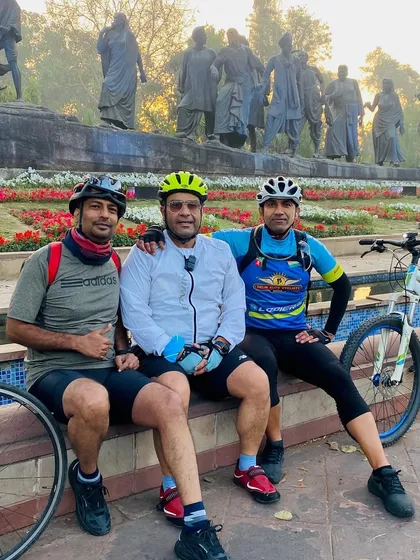 The group relaxing at the Gyarah Murti sculpture. It's a favorite resting spot for many Delhi cyclists.