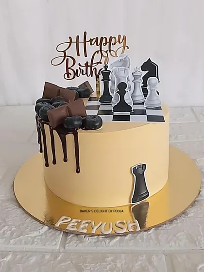 A cake for a chess lover, this design features a chessboard mid-game, complete with edible chess pieces and a chocolate drip.