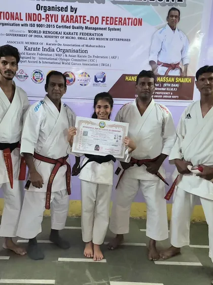 The coaching team with our newest black belt, Lekissha. It takes a team to guide a student, and we are all incredibly proud of her accomplishment.