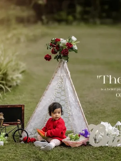 The world is a better place with these little ones in it. A beautiful wide shot of our outdoor teepee setup for a first birthday.