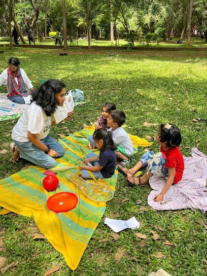 A small, intimate group of children listening intently. These smaller gatherings allow for wonderful interaction and a chance for every child to feel seen and heard.