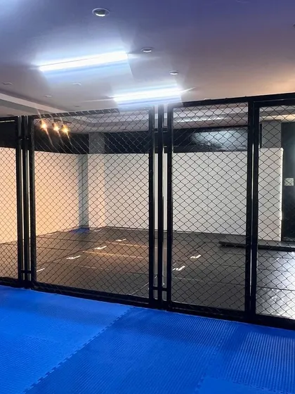 Welcome to the cage at our HSR Layout dojo. This is where you'll test your limits, spar with champions, and get the real fight feel. It's not a regular gym; it's a professional training ground.