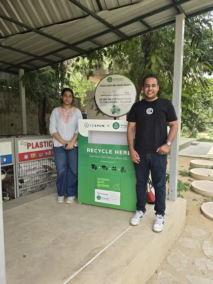 Two members of our community stand proudly by the newly installed Respun collection bin. Each item of clothing donated saves about 6 kg of CO2 and 2700 litres of water.