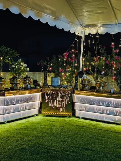 The rooftop garden at Ashirwad Banquets transforms into a magical setting at night. This illuminated buffet setup under the stars is perfect for evening receptions, sangeets, or corporate dinners.