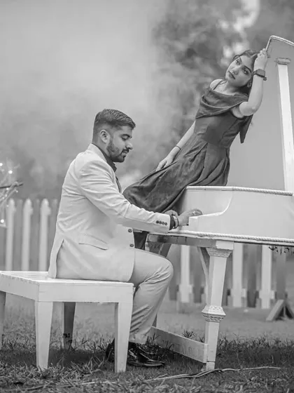 Another angle of the musical fairytale. The black and white treatment enhances the smoky, ethereal quality of the scene, focusing on the romance of the moment.