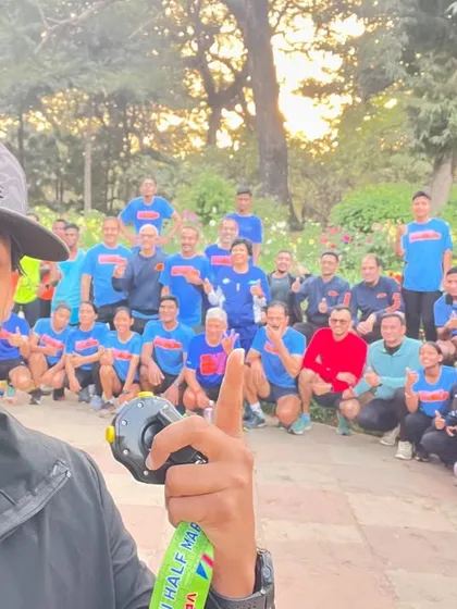 A selfie with my team in the background. I am proud to lead this group of dedicated runners every morning.