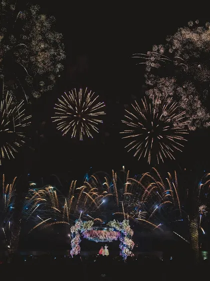 A spectacular fireworks display over a wedding mandap. For 7 years, we've been handling chaos with grace to create these moments of pure, unforgettable magic.
