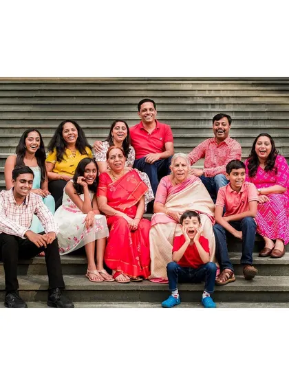 A vibrant, multi-generational family portrait session on a set of outdoor steps. We love the challenge of getting everyone from grandparents to the youngest kids laughing and looking great in one frame.