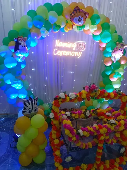 A closer view of the flower-decorated cradle for the naming ceremony.
