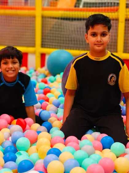 Two friends enjoying the endless fun of our giant ball pit.