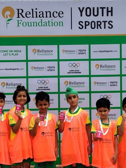 Our U-9 players proudly display their medals after a competitive match in the RFYL. These experiences are vital for their development as young athletes.