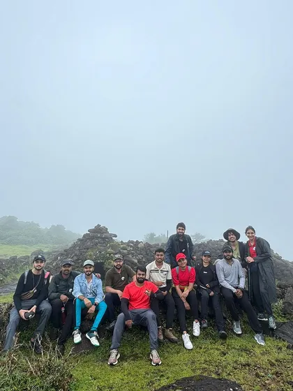 A group photo at a viewpoint on the Kumara Parvatha trail.