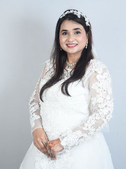 A beautiful portrait of a client in a long-sleeved lace wedding gown. So elegant and timeless.