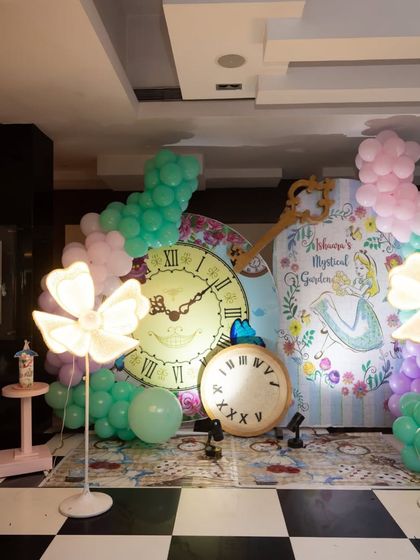 A full view of the 'Aishwarya's Mystical Garden' setup. The combination of pastel balloons, custom backdrops, and unique lighted props created a truly enchanting photo corner.