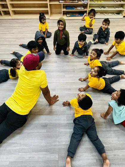 Even our warm-ups are fun. We incorporate simple and playful yoga poses like the cobra pose to help kids improve flexibility and learn about their bodies.