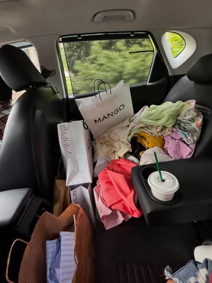 The not-so-glamorous but very real side of a stylist's life. My car often doubles as a mobile wardrobe, packed with shopping bags, clothing options, and of course, coffee to fuel a busy shoot day.