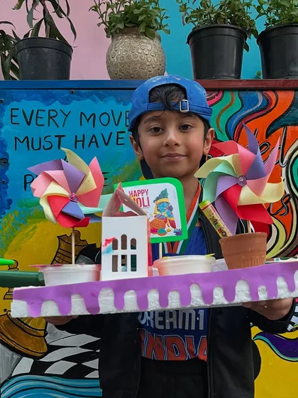 This creative Holi platter even includes a small paper house, showing the endless imagination of our students.