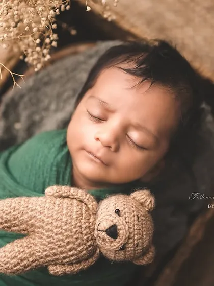 There is nothing more peaceful than a sleeping newborn. I am certified in safe baby posing, ensuring your little one is always comfortable and secure as we create these divine portraits with soft wraps and gentle props.