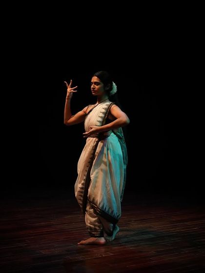 A Bharatanatyam dancer uses intricate hand gestures (mudras) to tell a story.