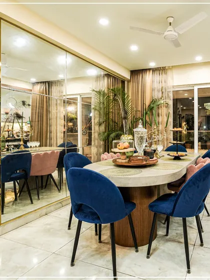 The dining room is where memories are made. For this space, I chose bold, jewel-toned velvet chairs and a large mirrored wall to create an atmosphere of modern luxury. It’s a design that feels both glamorous and welcoming, perfect for everything from daily meals to festive gatherings.