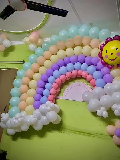 The vibrant colors of the rainbow balloon wall are sure to make everyone smile.