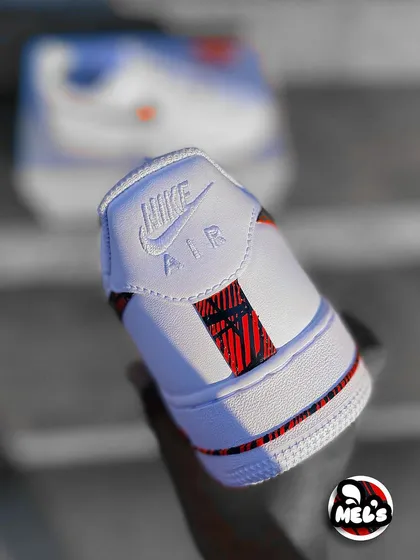 A focused shot of the heel of the MotoGP sneaker, with the other shoe blurred in the background.