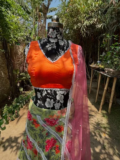 A front view of the blouse, with its flattering V-neckline and delicate lace trim.