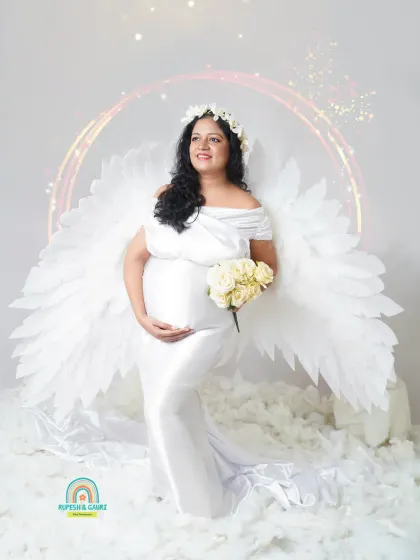 For the mom-to-be who wants something truly unique, we created this "Angel Wings" concept. This themed studio setup turns your maternity portrait into a piece of art, celebrating the angelic feeling of creating life.
