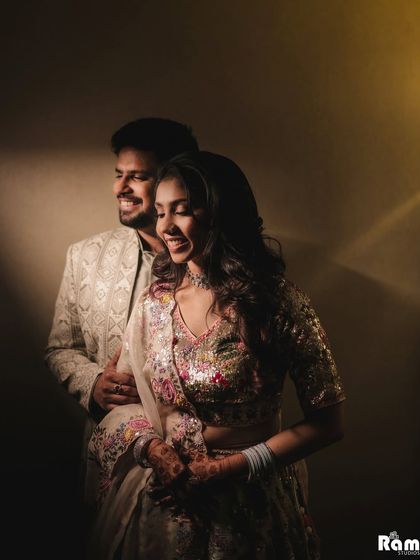 A beautiful indoor portrait filled with warmth and genuine laughter. I used a sliver of light to create a cozy and intimate atmosphere, capturing the couple's natural joy.