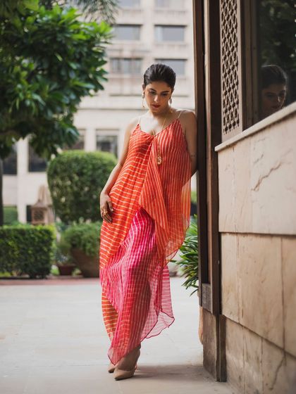 Isha Talwar in a vibrant, flowing dress. This portrait, taken outdoors, is all about capturing movement, color, and the feeling of being free in nature.
