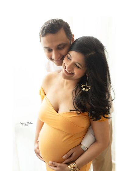 A beautiful, happy moment captured during a couple's maternity session. I love when couples forget the camera is there and just enjoy the moment together.