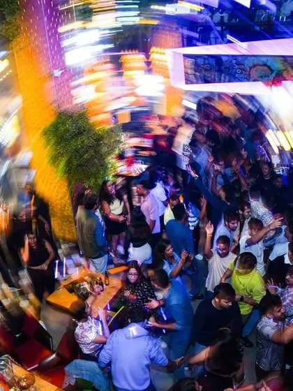This is the 'Party Ninja' effect. An overhead shot capturing the whirlwind of energy on the dance floor. My job is to get everyone lost in the music.