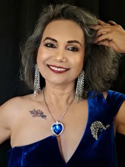 I believe glamour has no age. For this look on mature skin, I used techniques to create a radiant, lifted effect that doesn't settle into fine lines. The sapphire blue and silver tones create a bold, elegant statement perfect for any special occasion.