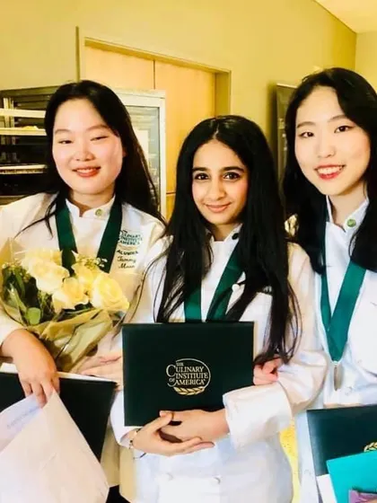 With my wonderful classmates at graduation. The friendships and connections I made during my culinary training are something I'll always cherish.