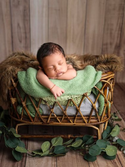 To the most gorgeous little boy. I love using earthy tones like green, which complement a rustic wooden backdrop and bring a natural feel to the portrait.