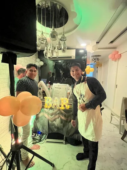 Posing with a guest at a house party. It's all about creating a fun, relaxed environment where everyone can enjoy themselves.