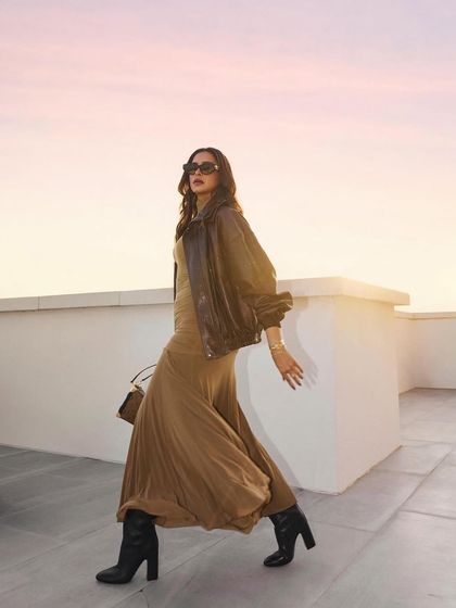 Deepika Padukone in motion. Her hair flows beautifully, demonstrating how a great cut and style can look stunning from every angle, even in a candid moment.