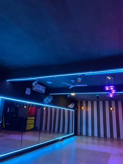 Welcome to our creative space. Our studio is equipped with full-length mirrors, professional sound, and dynamic neon lighting to create an inspiring atmosphere for every class.
